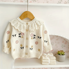 FloraKnit – Chaleureux et tendance – Cardigan en maille avec des détails floraux